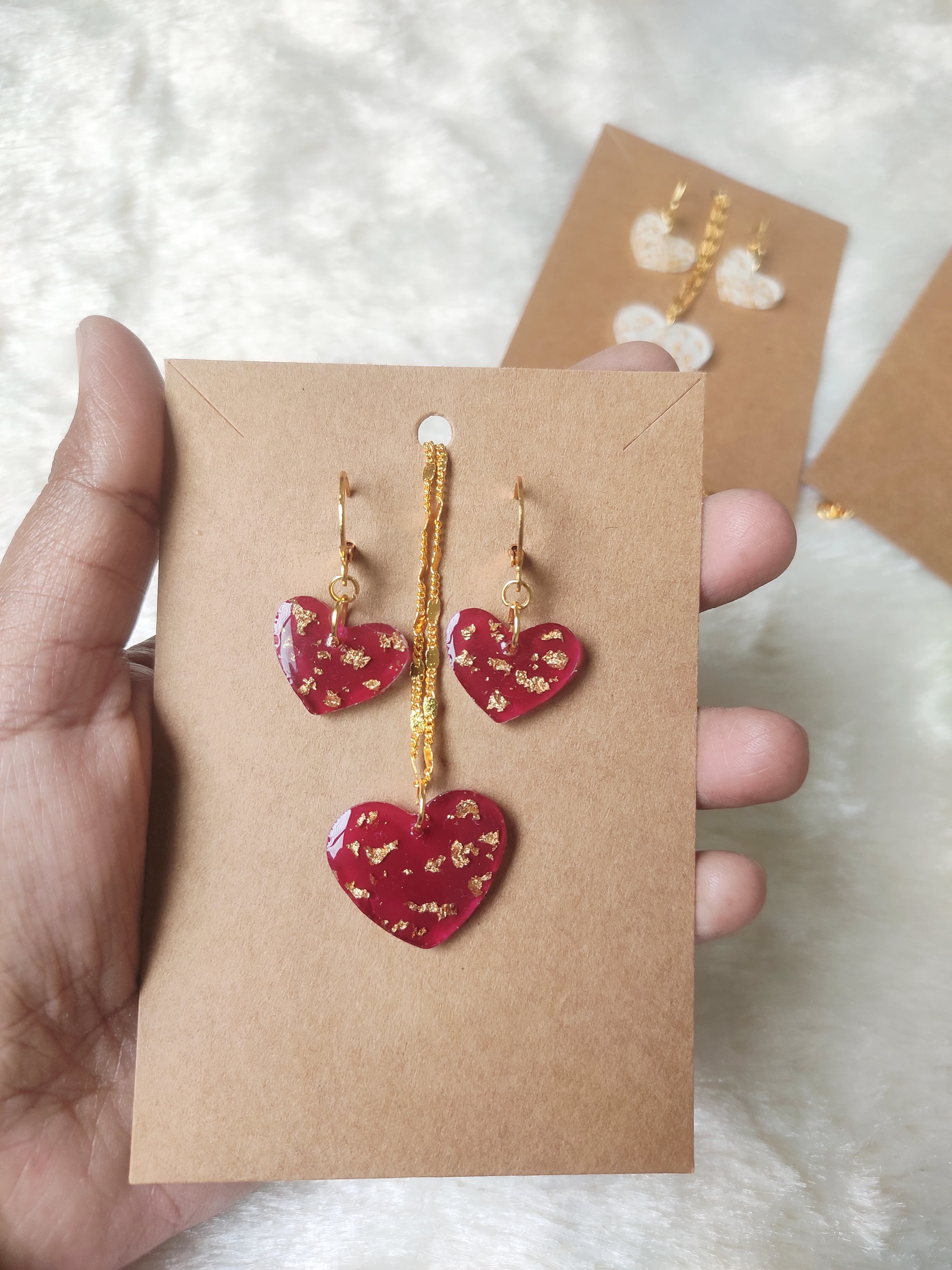 Maroon heart necklace.